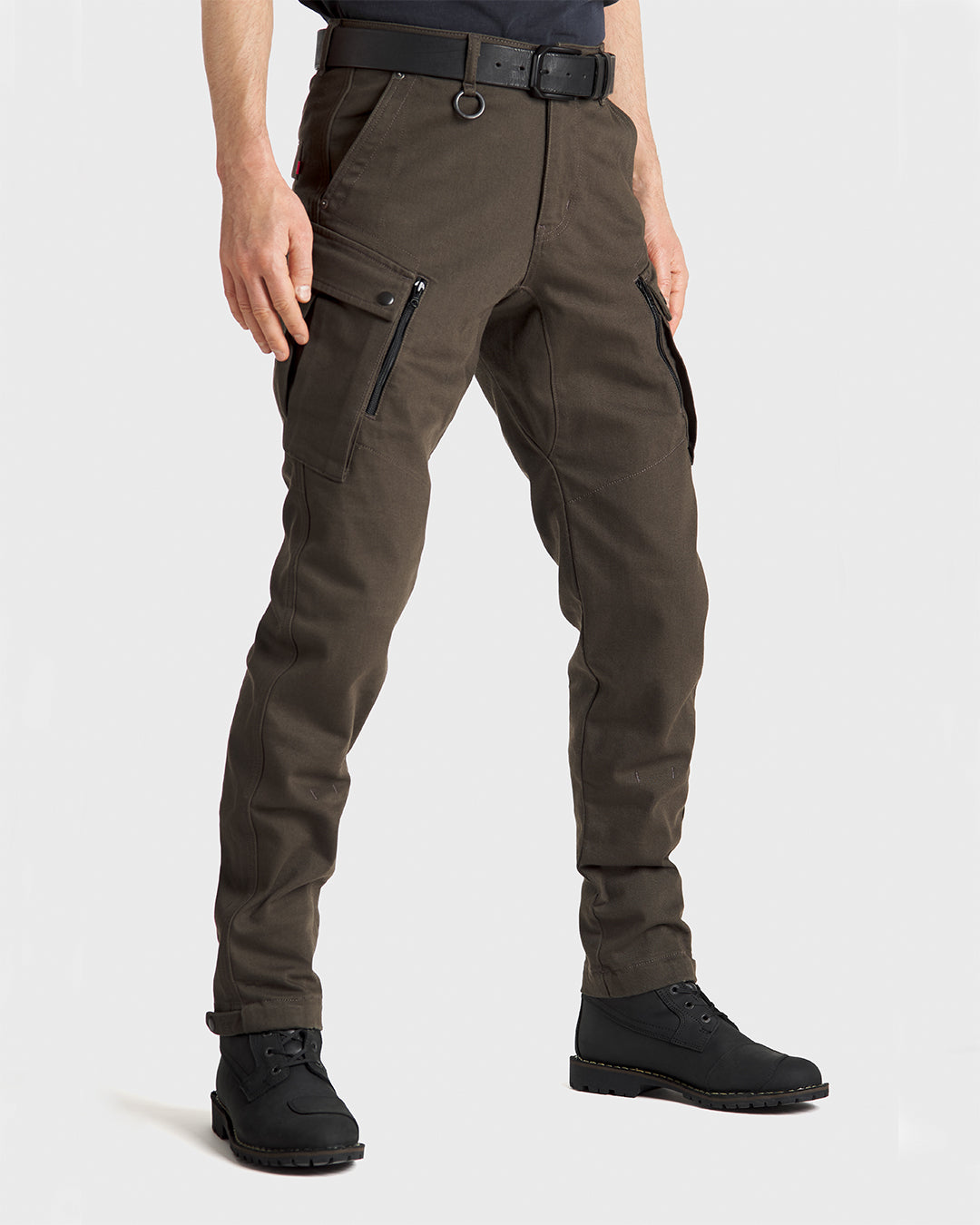 Man wearing olive green CE AAA rated motorcycle pant with a classic cargo fit, tapered cut, and button adjustable elasticized cuffs for a customizable, tapered fit
