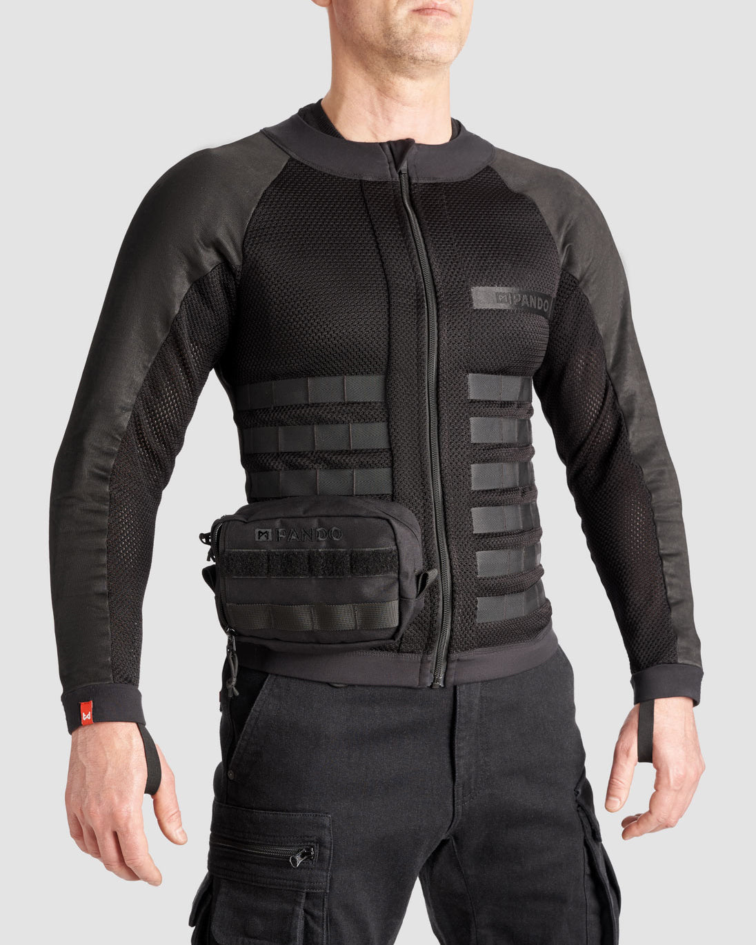 Man wearing tactical black CE AAA-rated armored mesh motorcycle shirt with UHMWPE fabric and 3D Cordura ventilation panels with MOLLE pouch