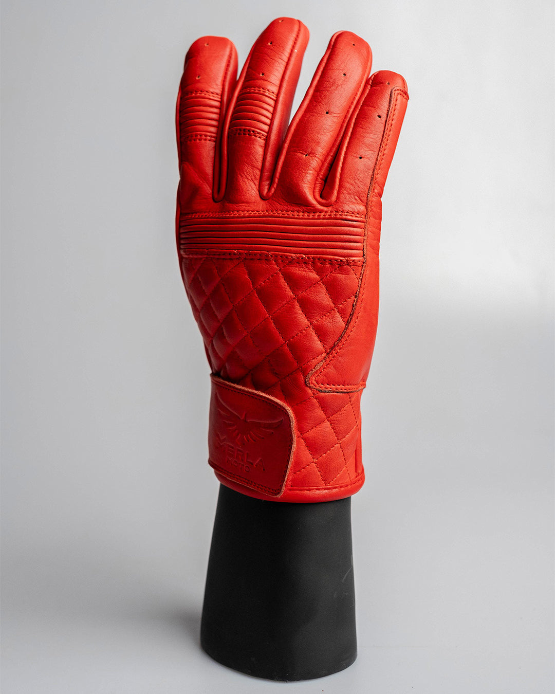 Merla Moto red leather motorcycle gloves showing quilted knuckle protection and detailed stitching