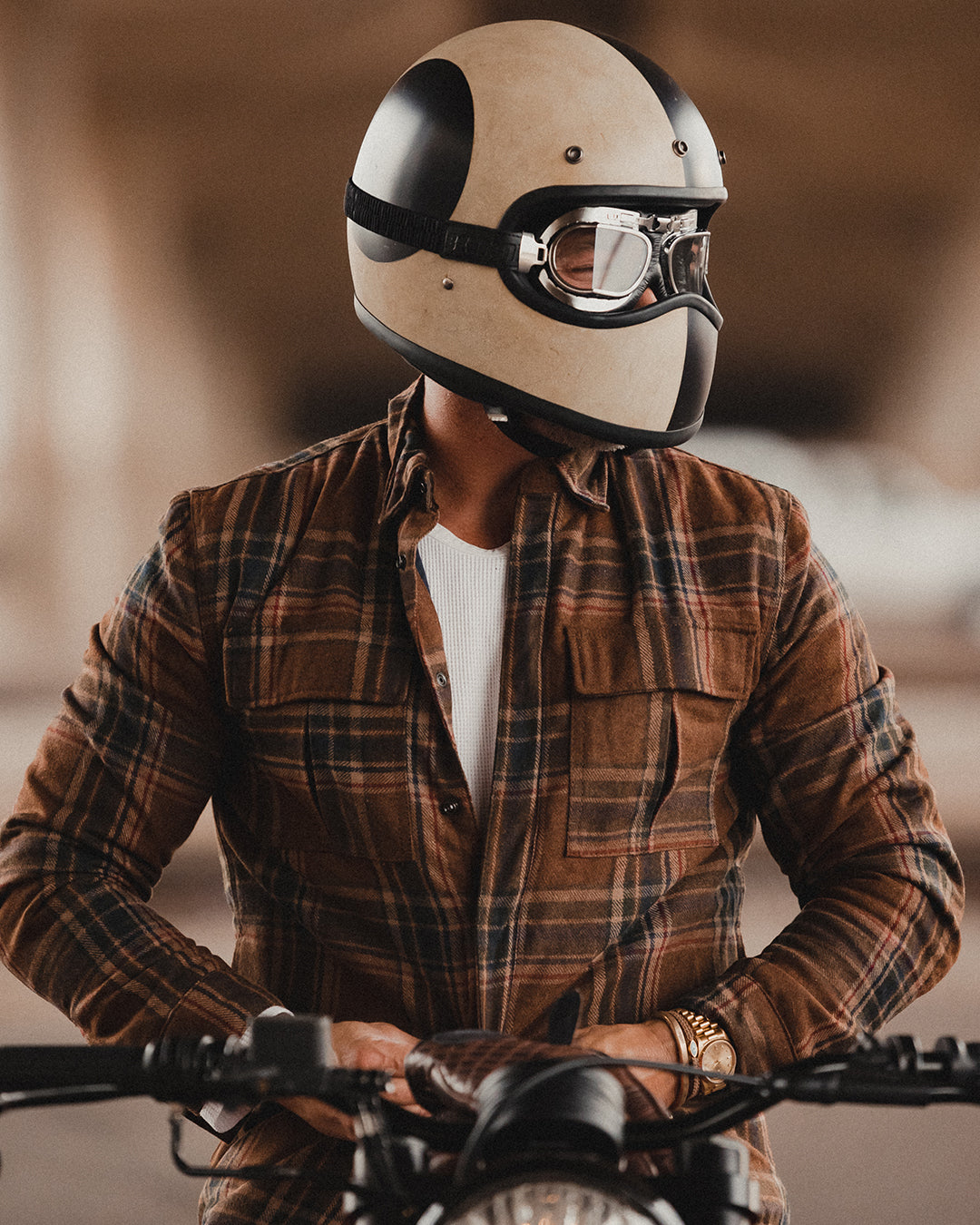 Motorcyclist wearing wool flannel motorcycle jacket with External zip pockets and snap pockets for functional storage and safety armor compatibility