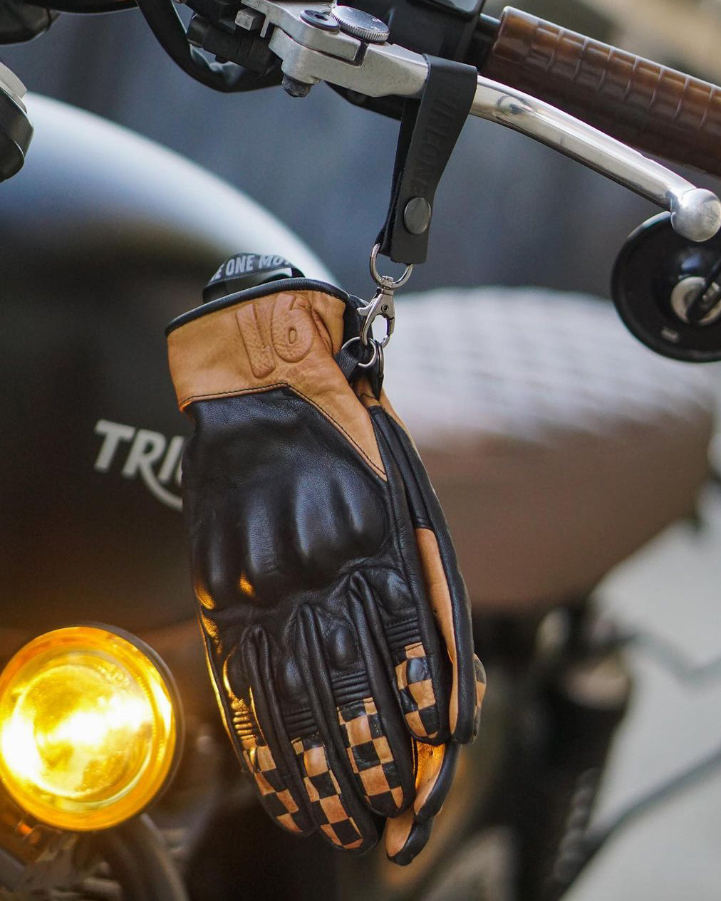 The Checkmate Gloves by Nineone Moto made from 100% cowhide and goatskin, featuring padded palms reinforced with Kevlar for abrasion resistance and CE-approved knuckle protection