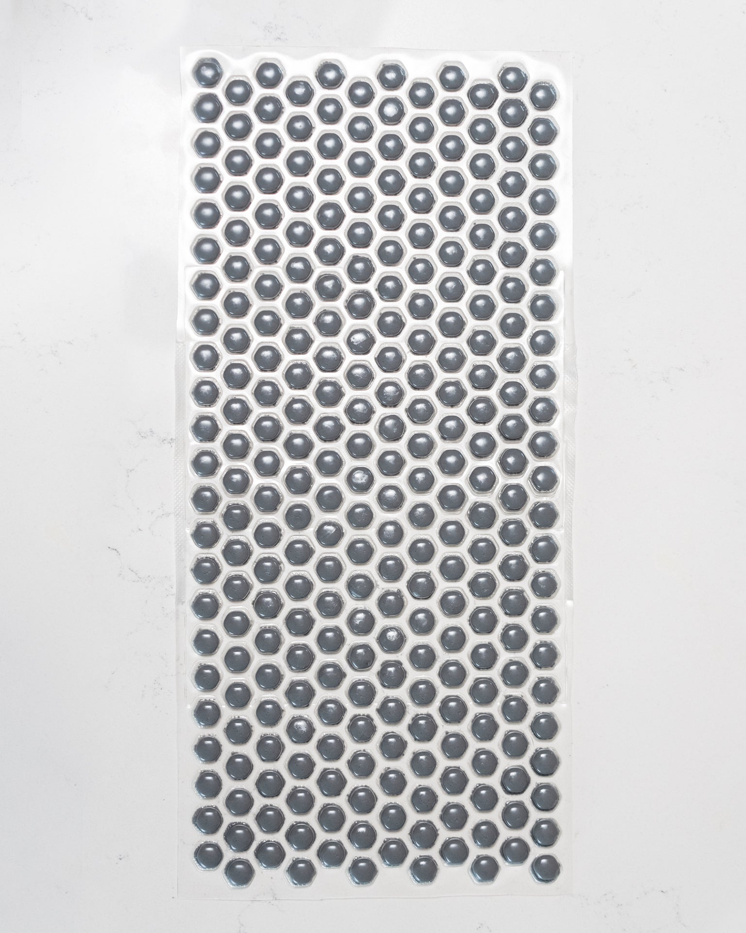 Custom-cut polymer armor sheet with TPU-coated impact protection bubbles for body armor use