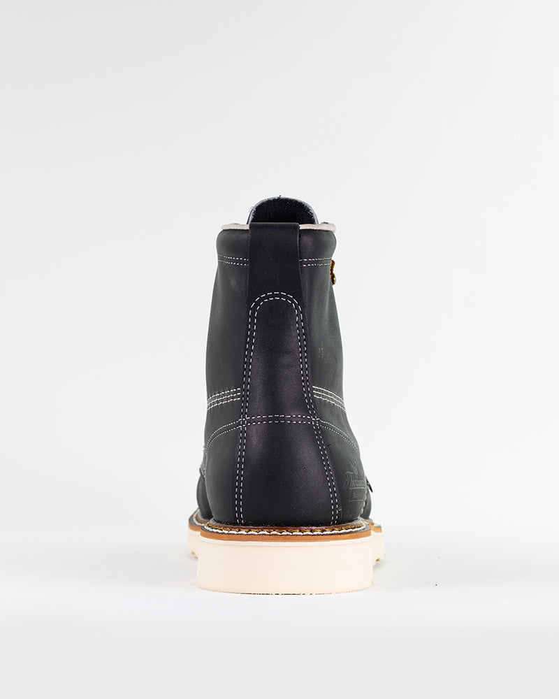 Rear view of black, leather Thorogood moc toe boots