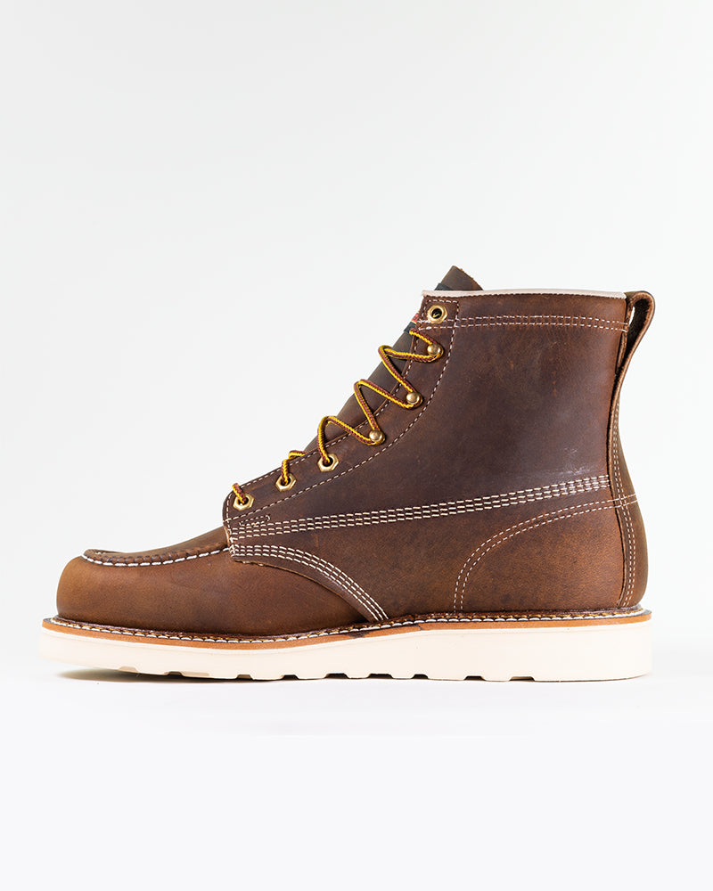 Side view of stylish, leather, steel-toe workwear boots