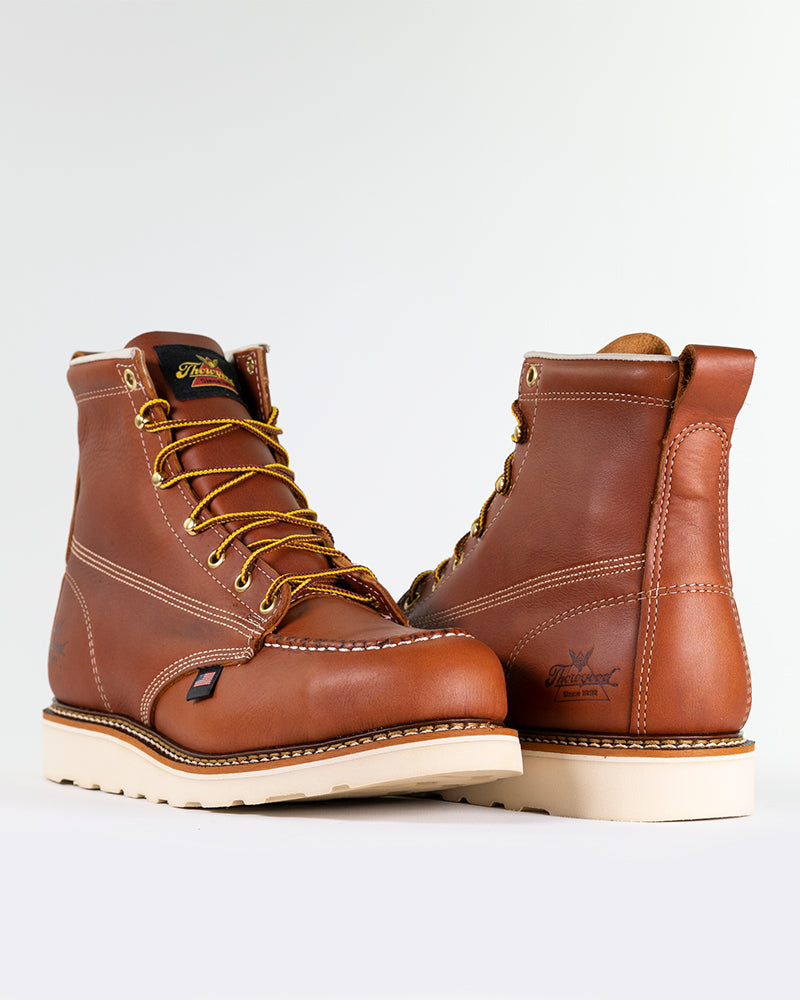 Slip-resistant, steel moc-toe, full-grain leather boots.
