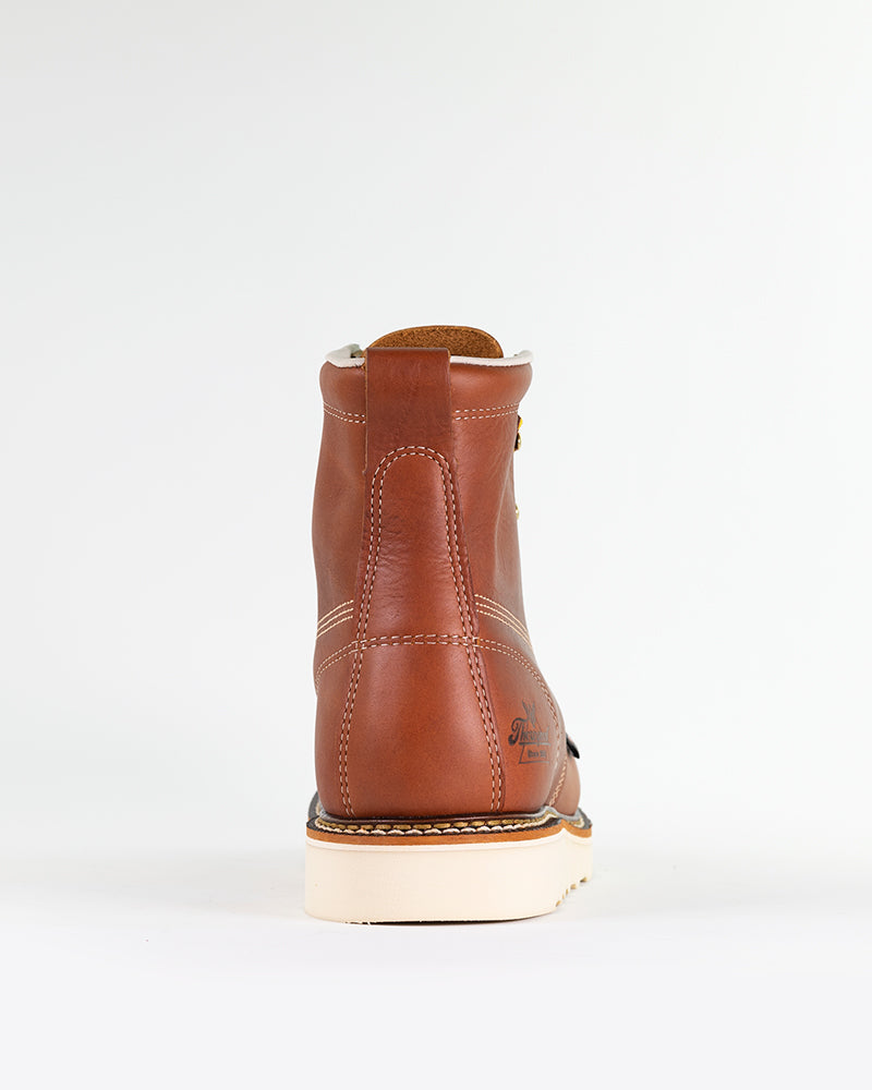 Rear view of American-made Thorogood 6" Moc Toe work boots in Tobacco, with a rounded moc-toe design, steel safety toe meeting ASTM standards, and comfort weave lining for a snug fit