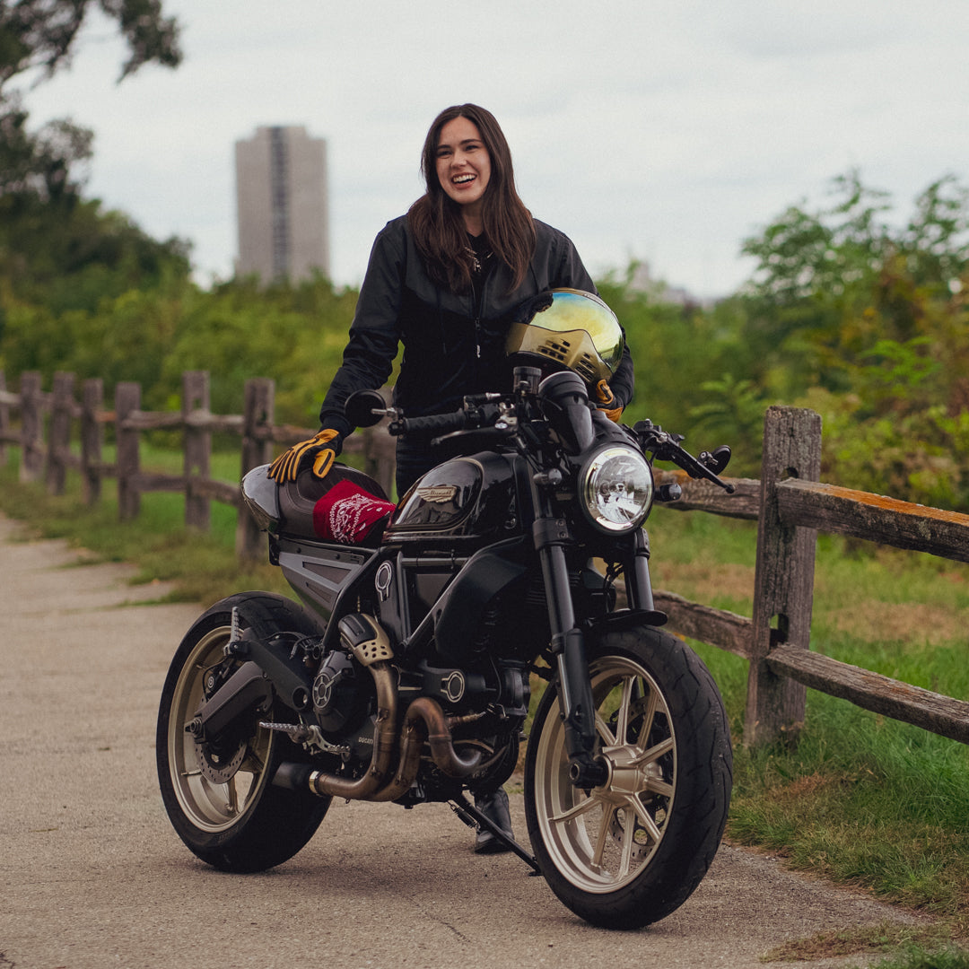 Meghan Stark founder of Stealth Armor Co. with her custom 2017 Ducati Scrambler Cafe Racer